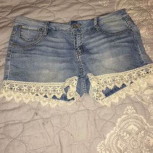 Low rise jean shorts with lace on the bottom